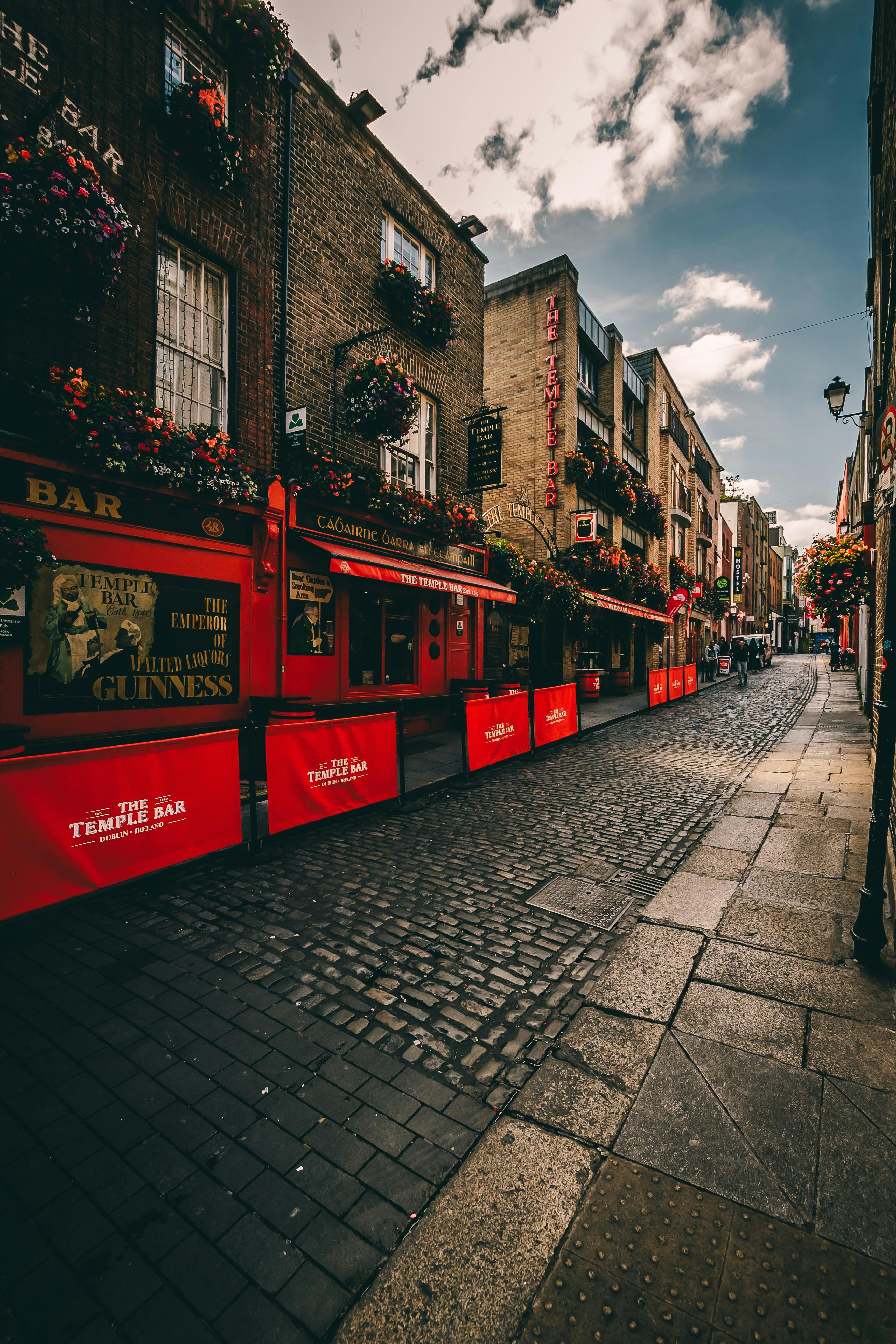 A street with traditional buildings and flowers in a European city