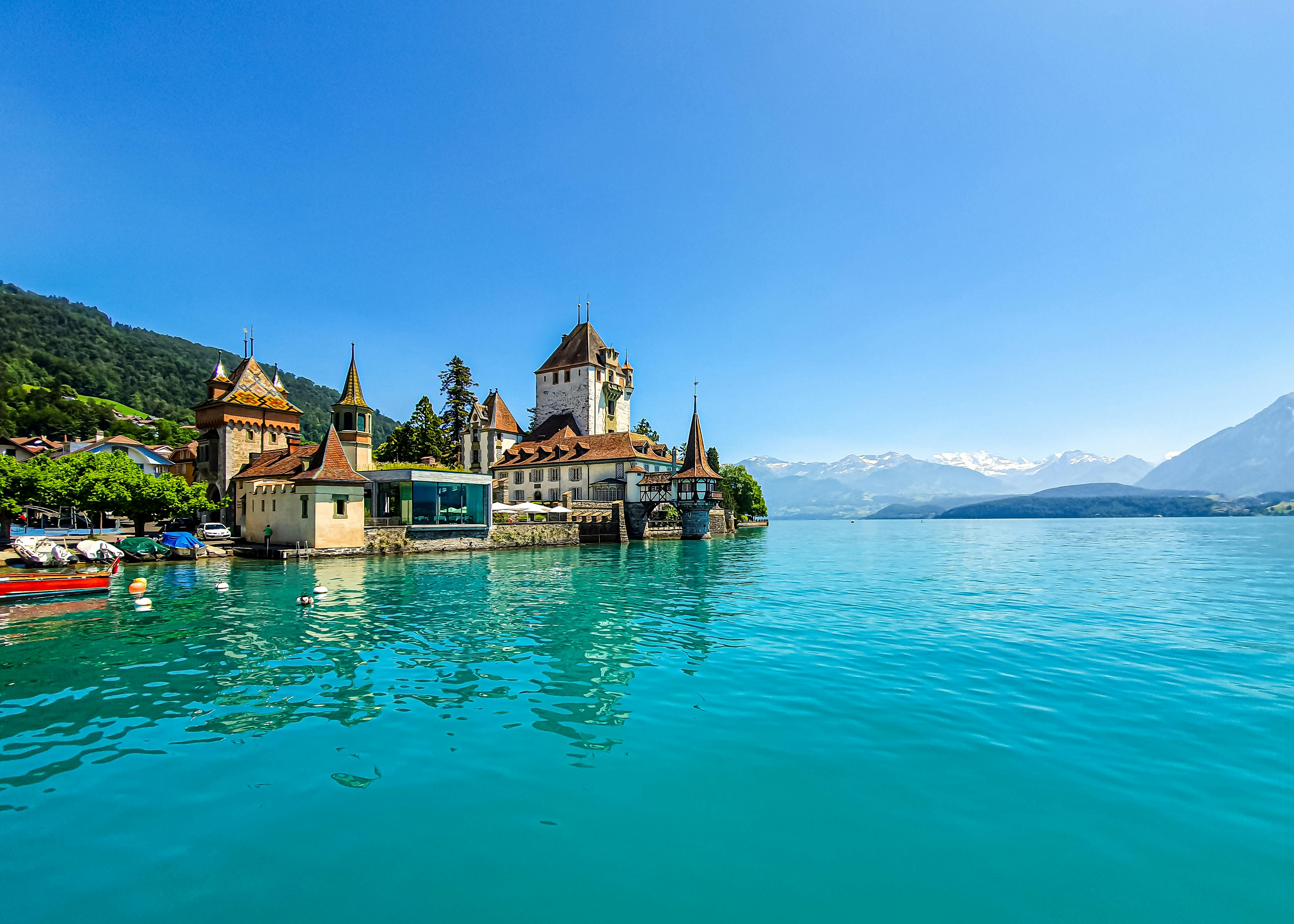 Swiss Alps with green valleys and snow-capped mountains
